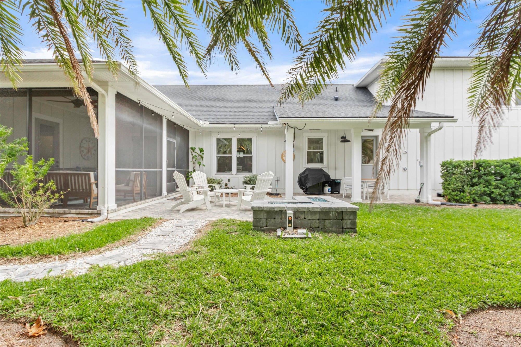 80 Ferrol Road St. Augustine, FL 32084 - Photo 42 of 61 a view of a house with backyard and a sitting area