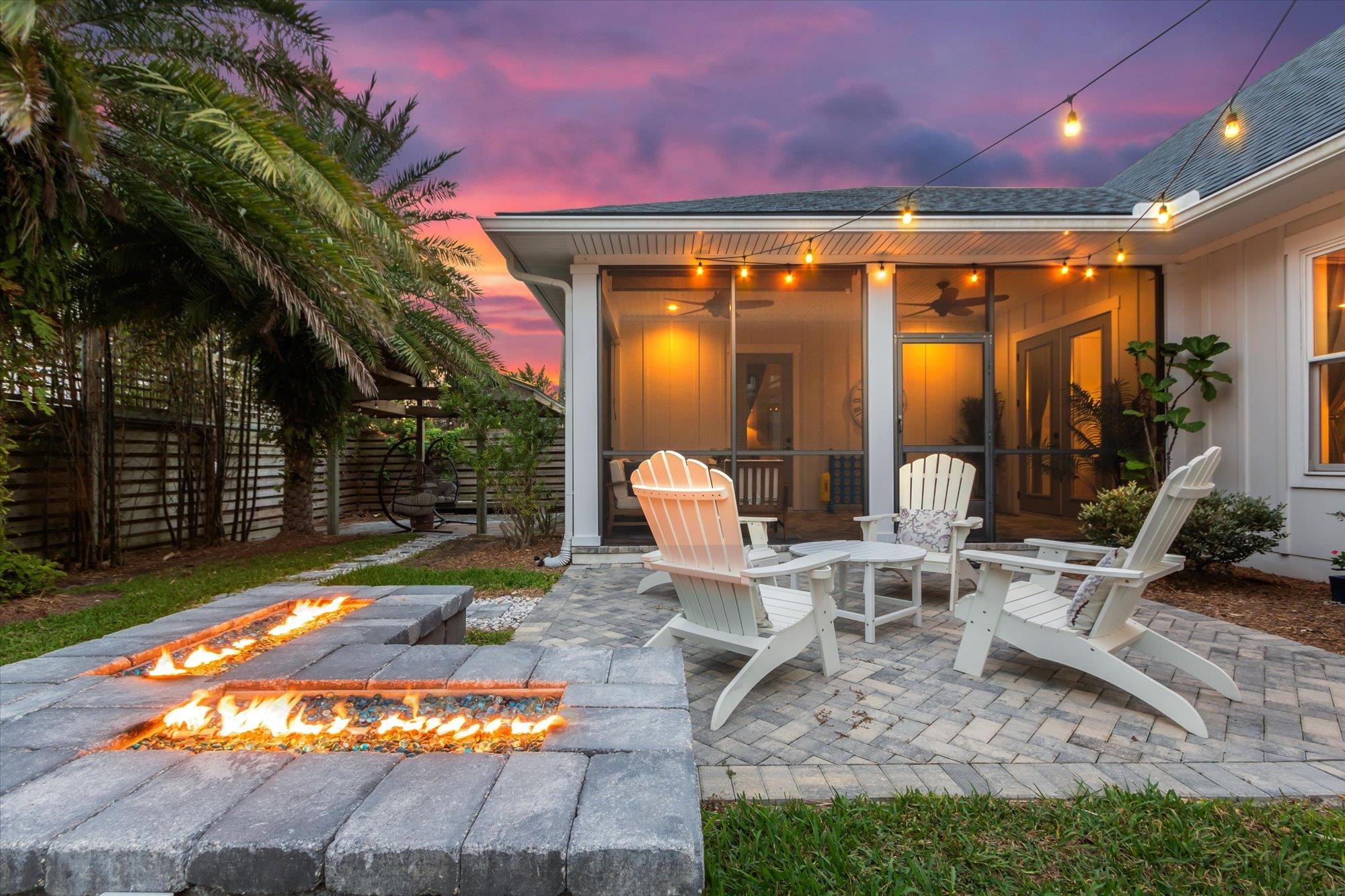 80 Ferrol Road St. Augustine, FL 32084 - Photo 45 of 61 a view of a chairs and fire pit in the patio