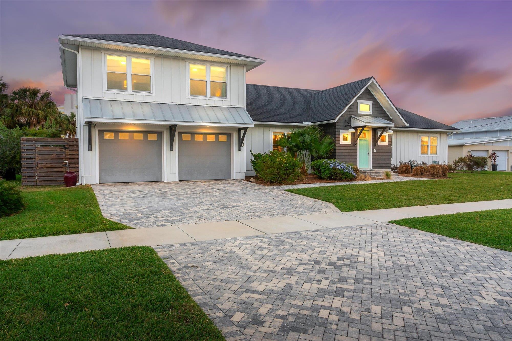 80 Ferrol Road St. Augustine, FL 32084 - Photo 48 of 61 a front view of a house with a yard and garage
