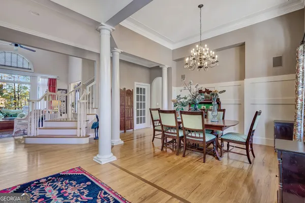 a bedroom with furniture and a book shelf