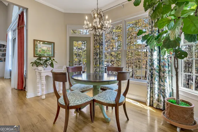 a living room filled with furniture window and entryway