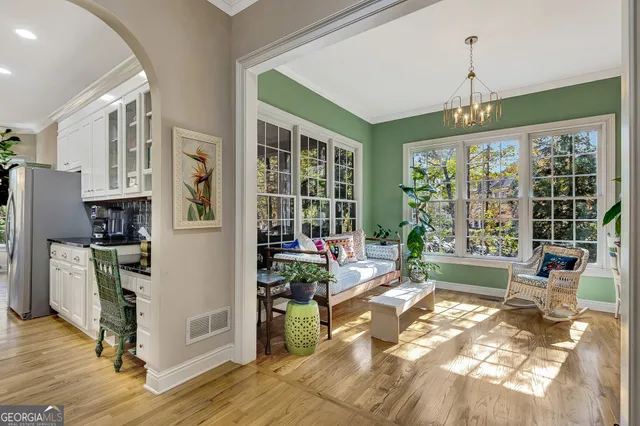 a lobby with furniture and flowers