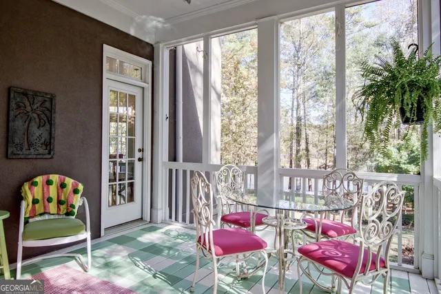 a bed room with a bed and a large window