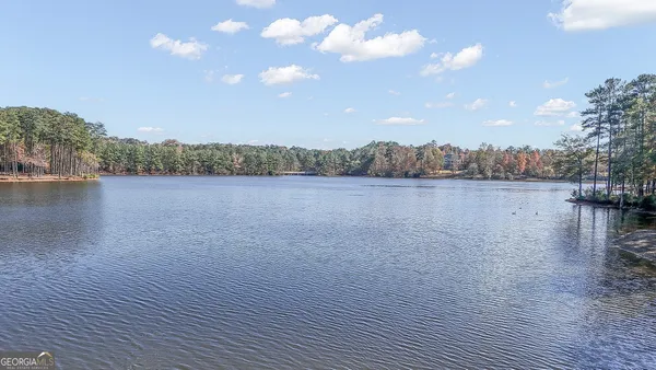 an aerial view of a house with a lake view