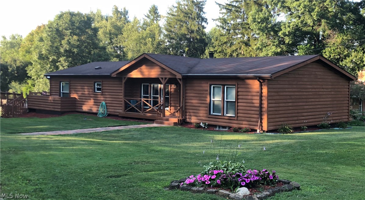 15194 Wadsworth Rittman Road Rittman, OH 44270 - Photo 1 of 7 FRONT VIEW. LOG CABIN STYLE RANCH. ALL NEW WINDOWS 2017. FOUNDATION RE-PAINTED SUMMER 2018.
