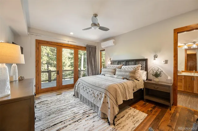 a bedroom with a large bed and a large window