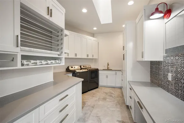 a kitchen with a sink stove and refrigerator
