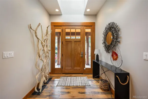 a view of entryway with wooden floor