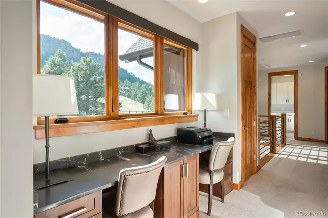 a room with a table chairs and entryway