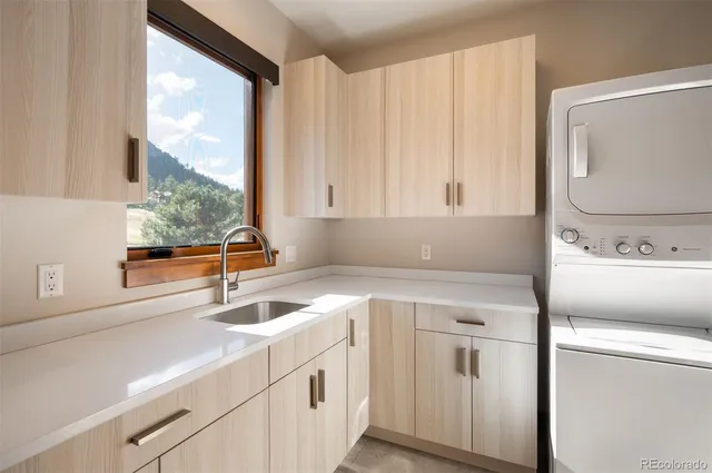 a kitchen with a sink and a window