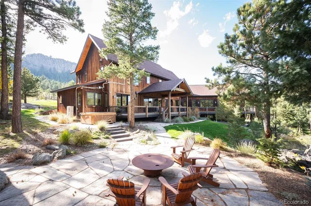 a view of a house with backyard porch and sitting area