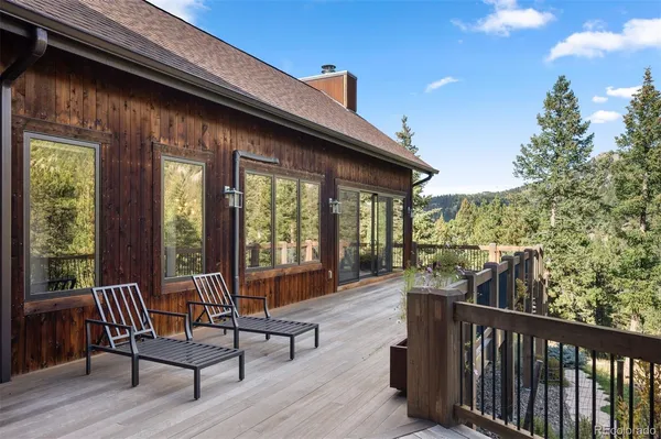 a view of a patio with a table and chairs