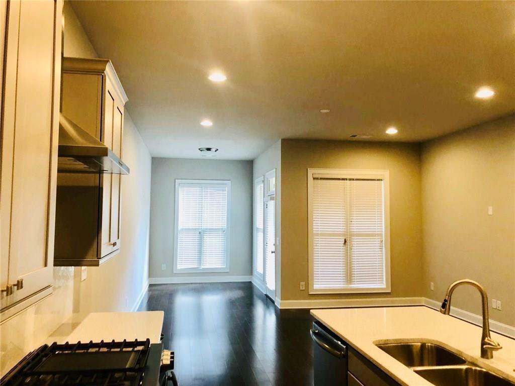 257 Franklin Road Sandy Springs, GA 30342 - Photo 13 of 14 a kitchen with a sink and a refrigerator