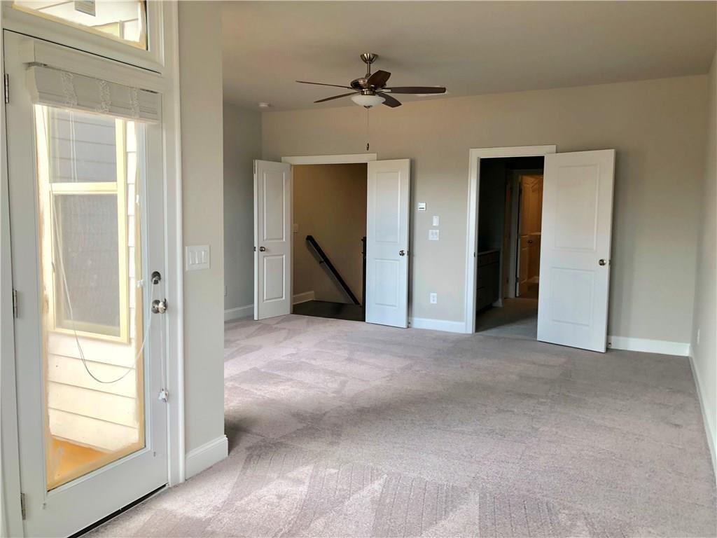 257 Franklin Road Sandy Springs, GA 30342 - Photo 9 of 14 a view of an empty room with a ceiling fan