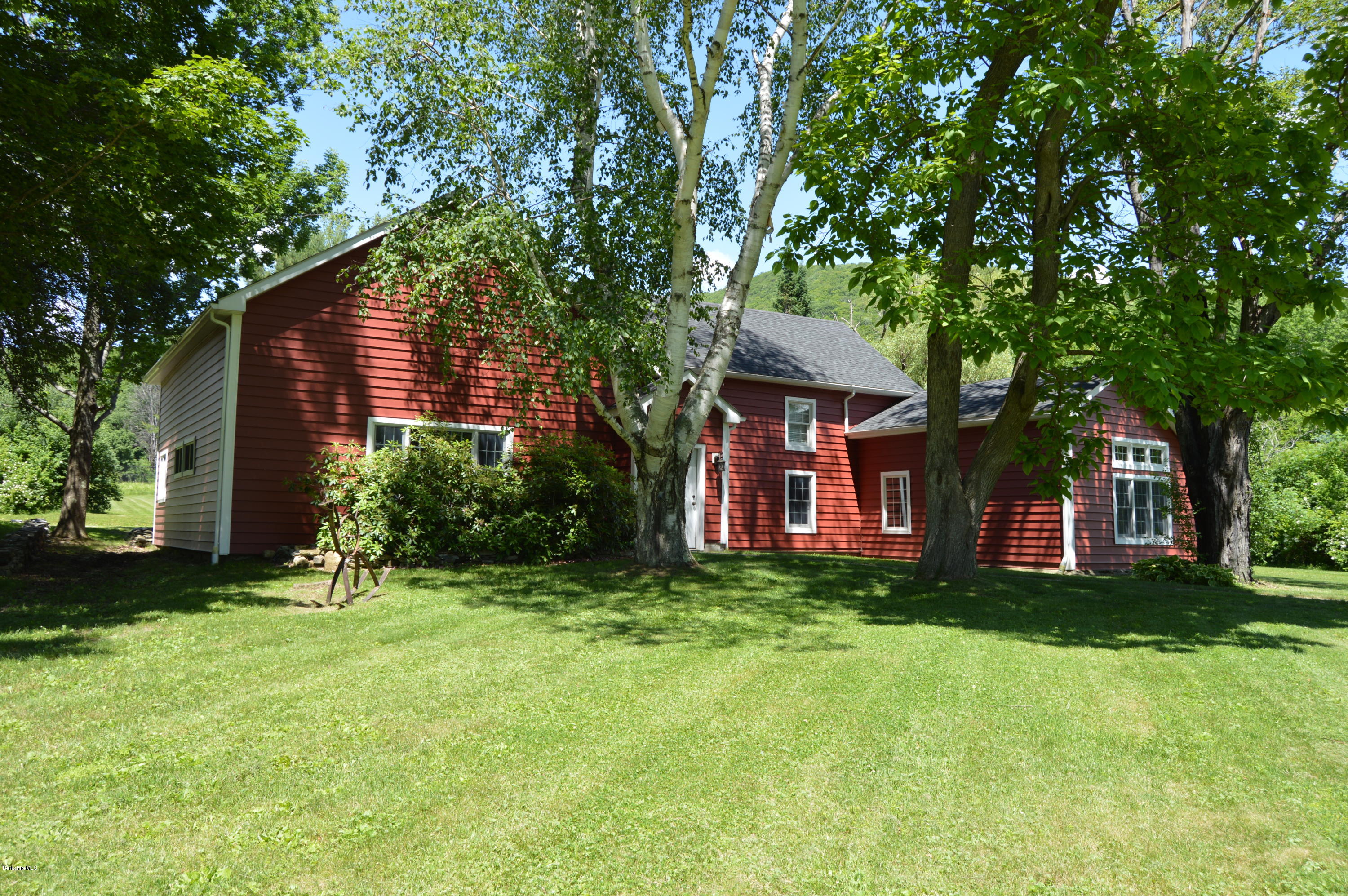 202-204 Whitman Road Hancock, MA 01267 - Photo 2 of 59 a front view of a house with a yard