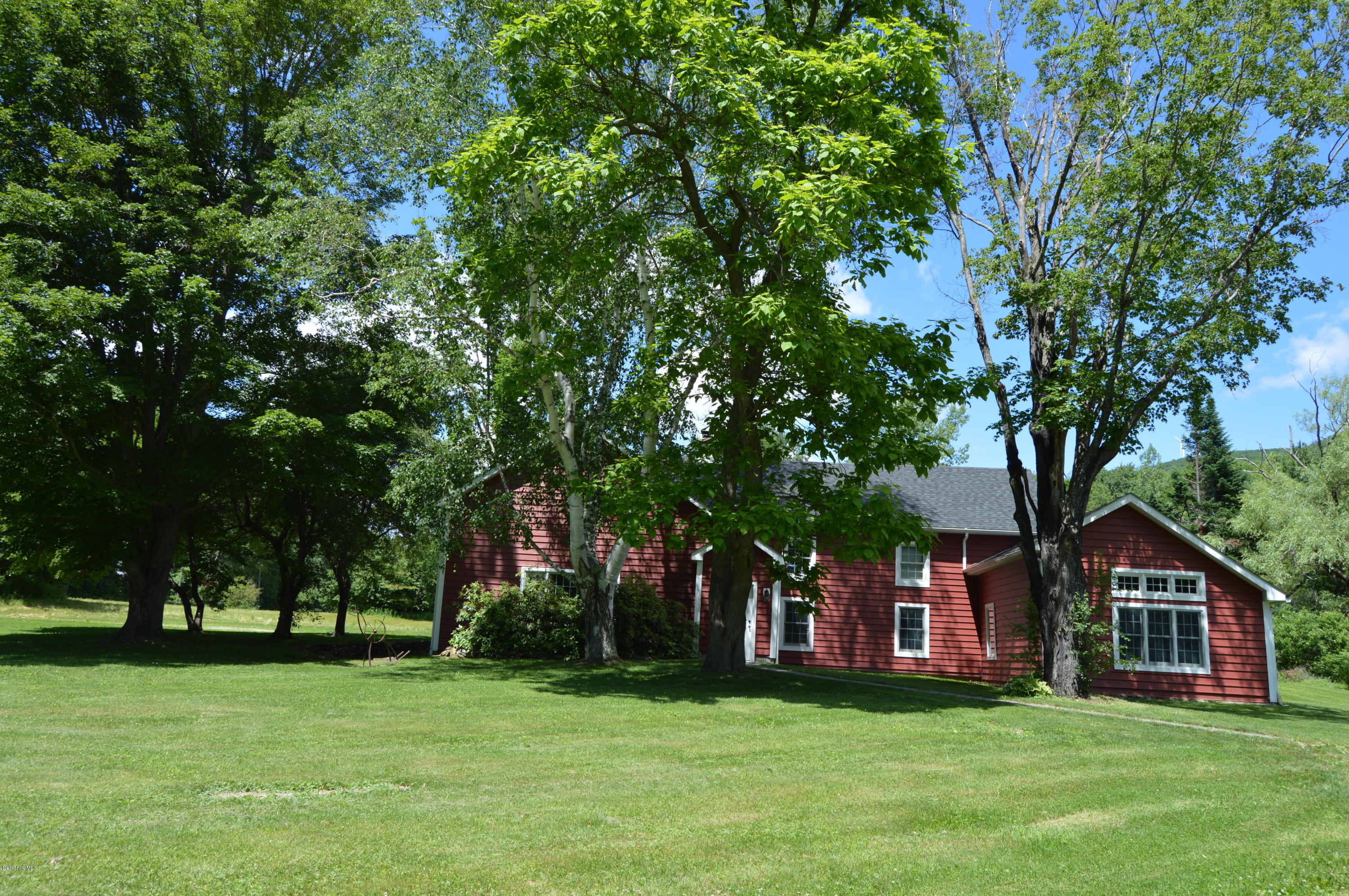 202-204 Whitman Road Hancock, MA 01267 - Photo 12 of 59 a view of a house with a big yard and large trees