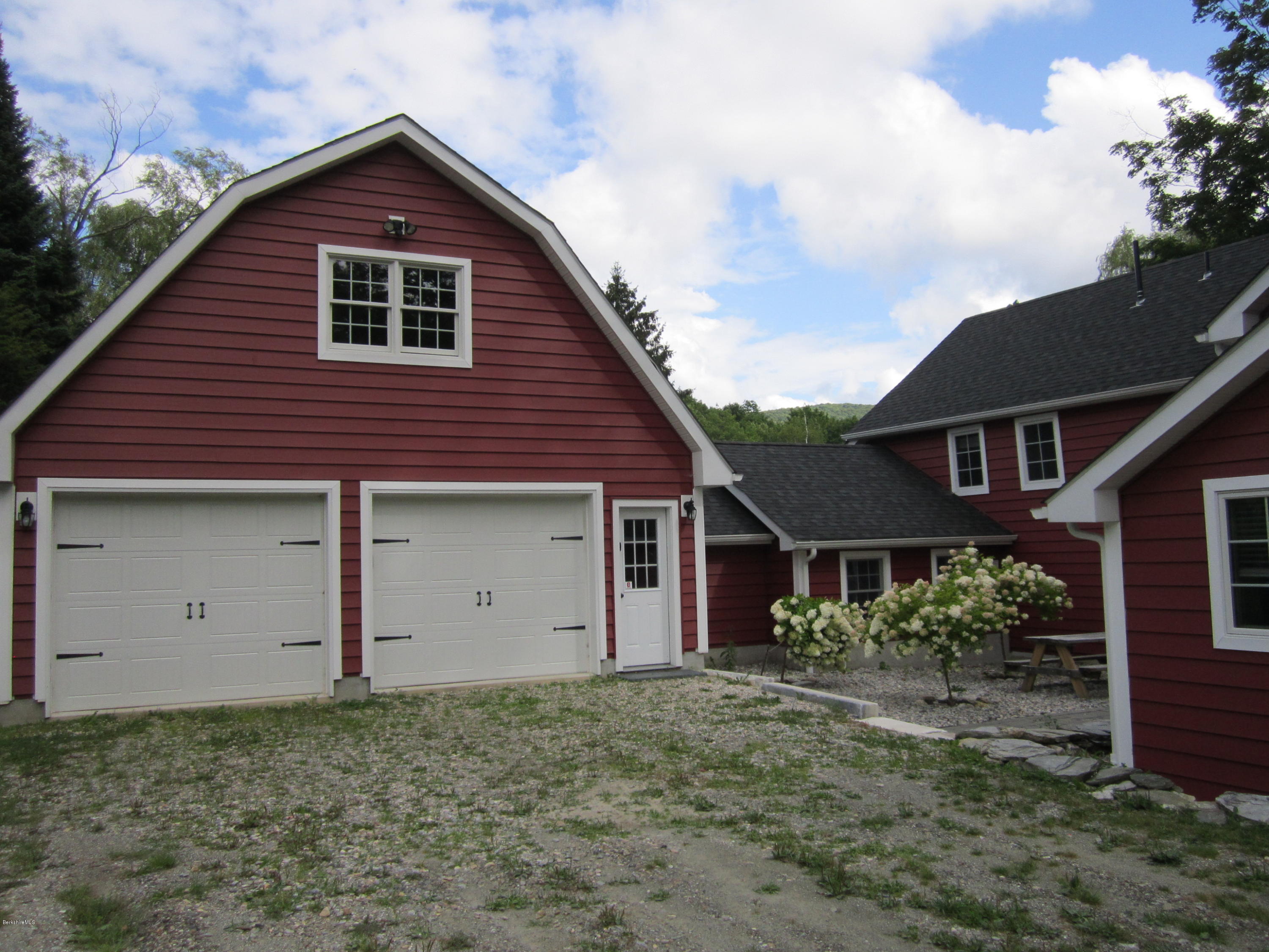 202-204 Whitman Road Hancock, MA 01267 - Photo 15 of 59 a front view of a house with a yard