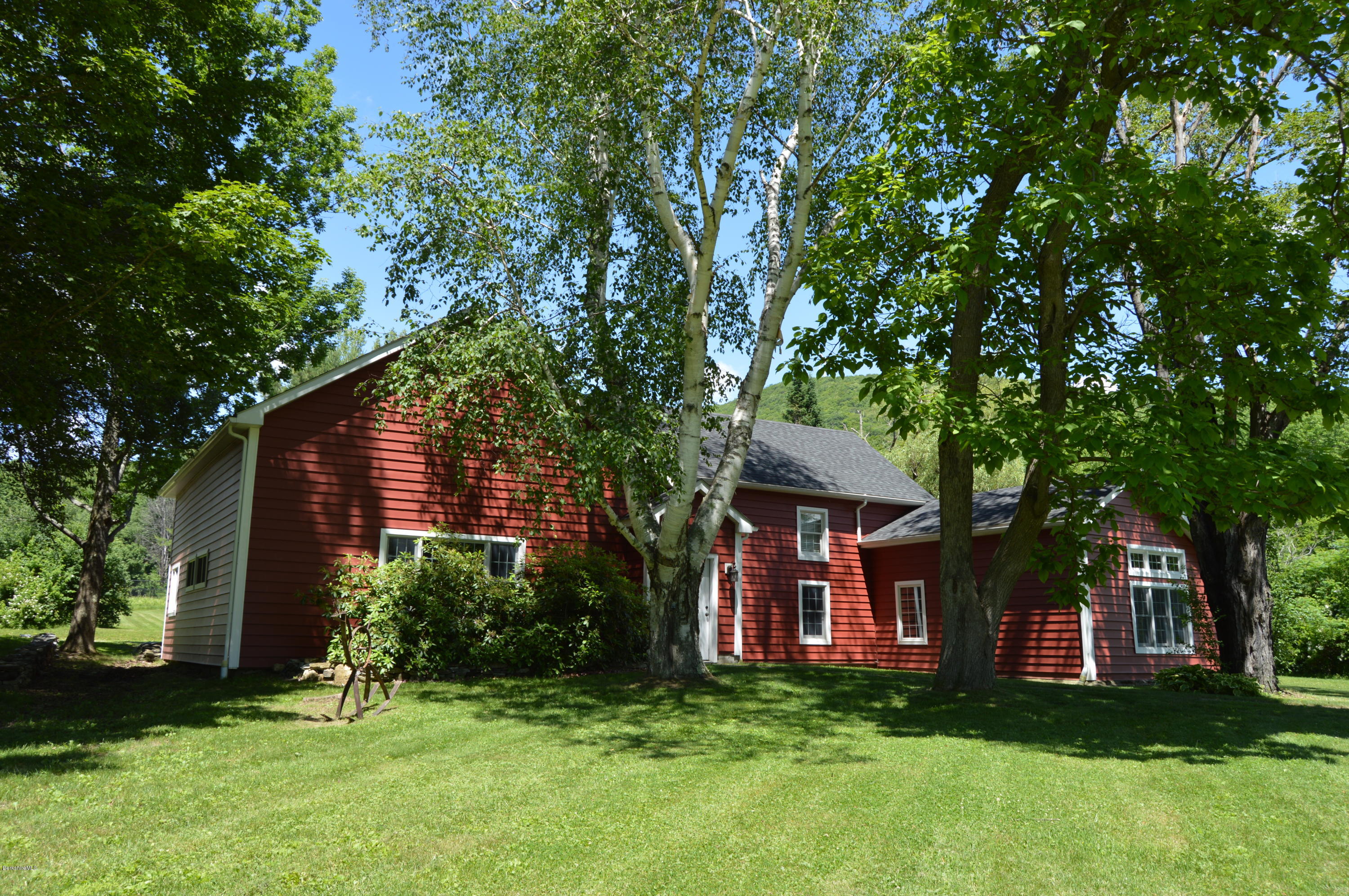 202-204 Whitman Road Hancock, MA 01267 - Photo 3 of 59 a front view of a house with a garden