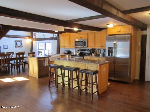 202-204 Whitman Road Hancock, MA 01267 - Photo 21 of 59 a large kitchen with a table and chairs