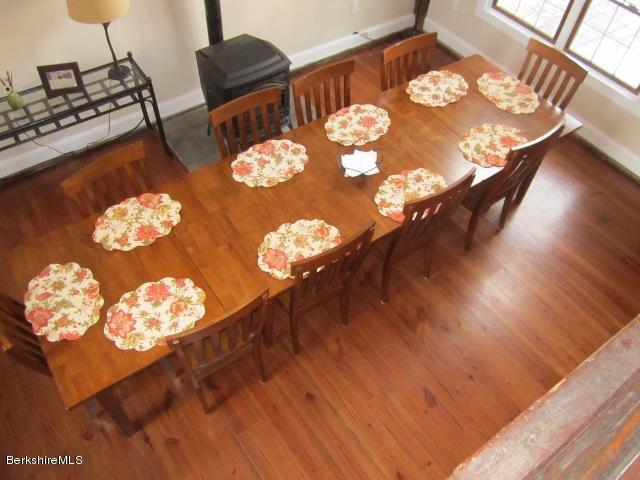 202-204 Whitman Road Hancock, MA 01267 - Photo 26 of 59 a view of a dining room with furniture and wooden floor