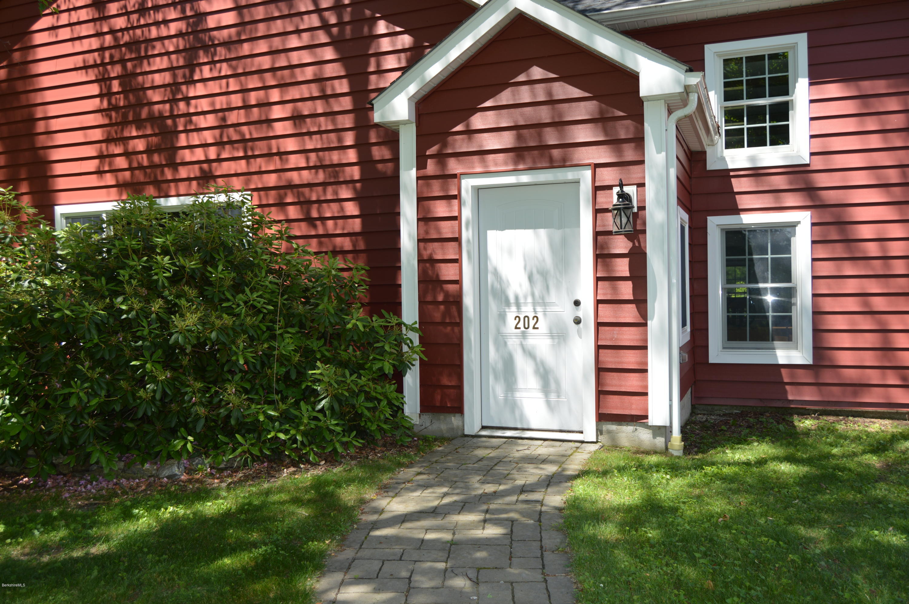 202-204 Whitman Road Hancock, MA 01267 - Photo 4 of 59 a front view of a house with garden