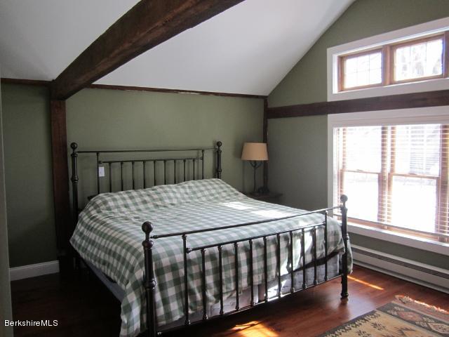 202-204 Whitman Road Hancock, MA 01267 - Photo 36 of 59 a bedroom with a bed and wooden floor