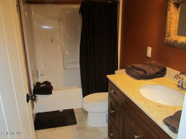 202-204 Whitman Road Hancock, MA 01267 - Photo 41 of 59 a bathroom with a sink and a toilet