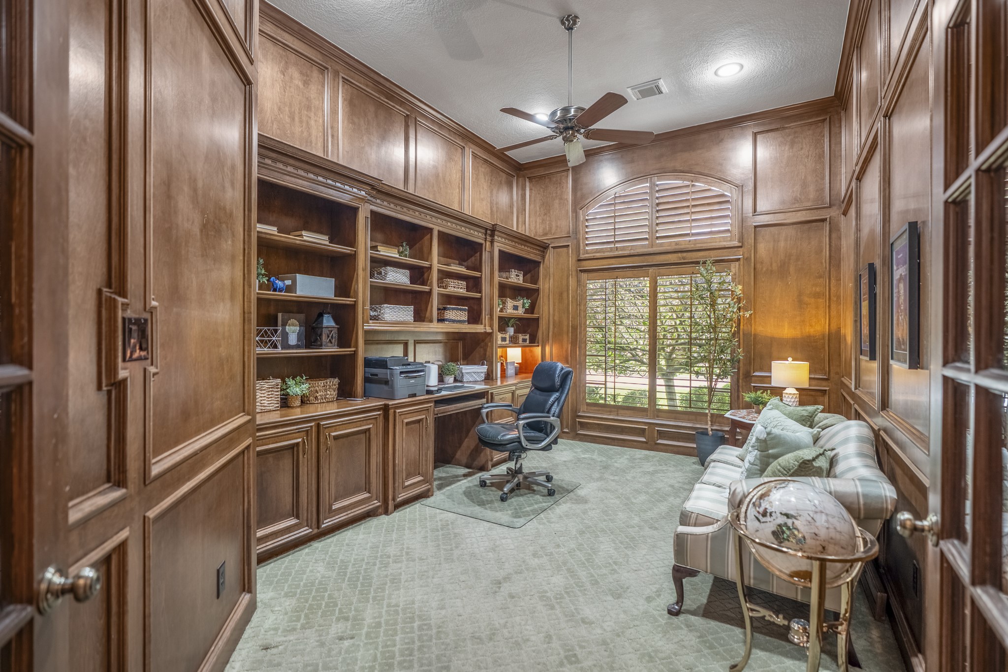 8806 Sterling Gate Circle Spring, TX 77379 - Photo 9 of 40 Home office features warm wood paneling, custom shelves and plantation shutters.