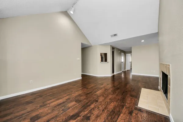 a view of a livingroom with wooden floor