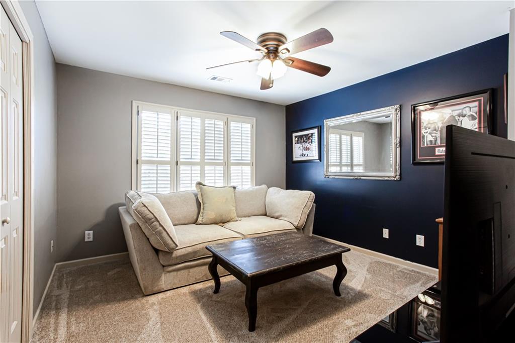 4010 Rockingham Drive Roswell, GA 30075 - Photo 22 of 36 a living room with furniture and a window