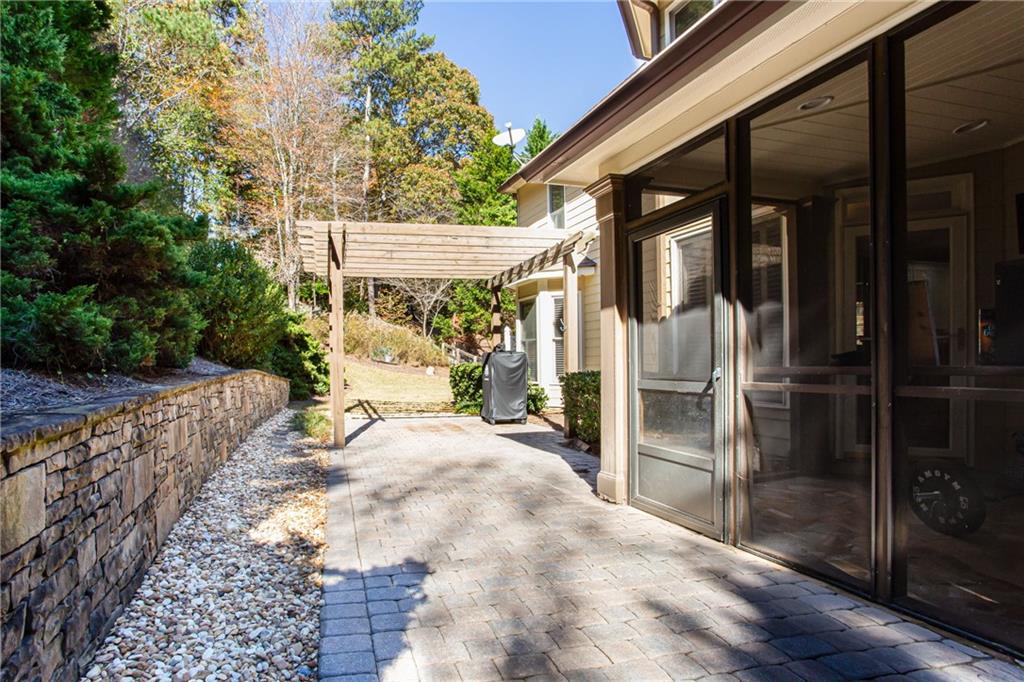 4010 Rockingham Drive Roswell, GA 30075 - Photo 26 of 36 a view of a house with backyard and sitting area