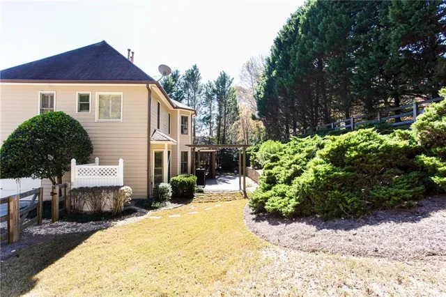 a view of a house with snow on the background