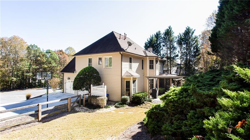 4010 Rockingham Drive Roswell, GA 30075 - Photo 30 of 36 a view of a house with snow on the background