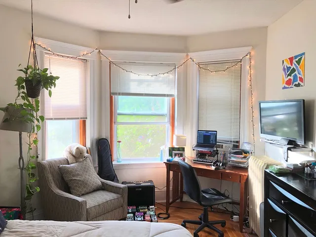 a workspace with furniture and a flat screen tv