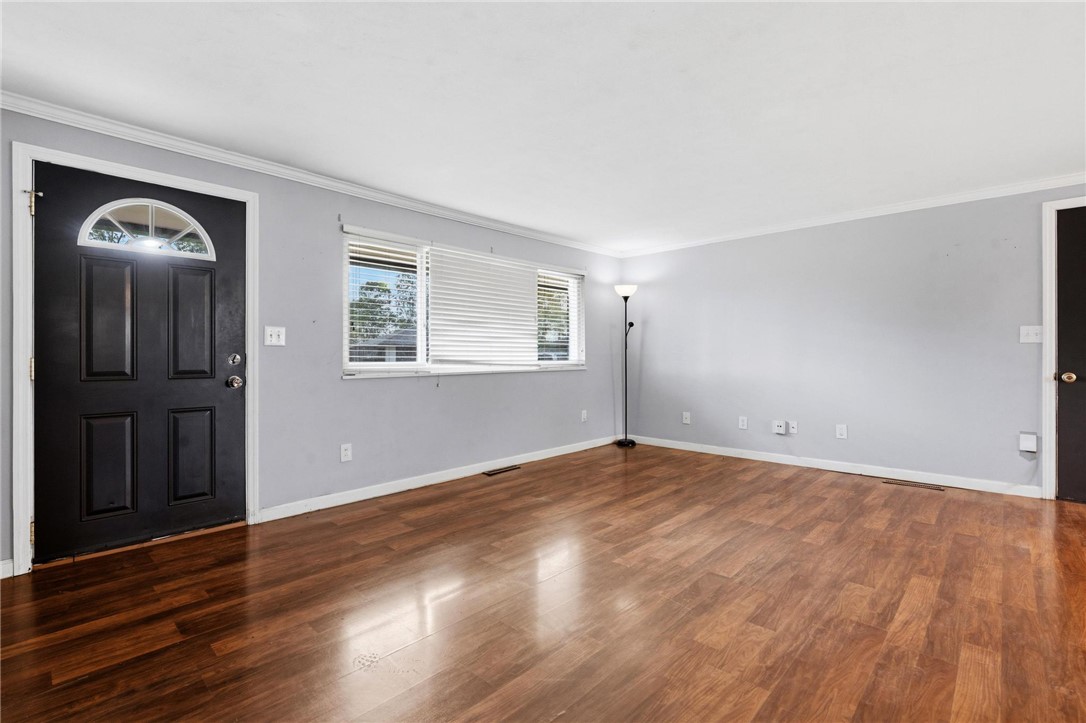 3890 Endover Road Dayton, OH 45439 - Photo 11 of 26 This inviting space features durable wood flooring and ample natural light, creating a bright atmosphere.