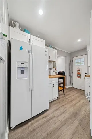a bathroom with a sink toilet a mirror and shower