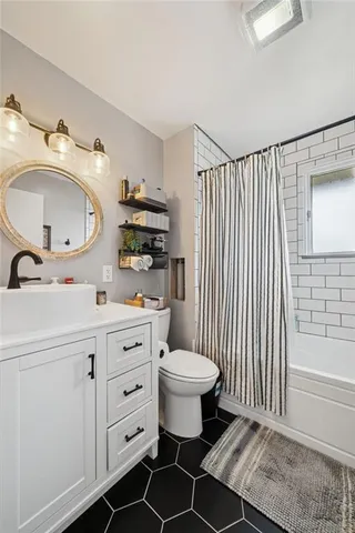 a bedroom with a bed and furniture