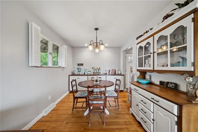 a kitchen with a table and chairs in it