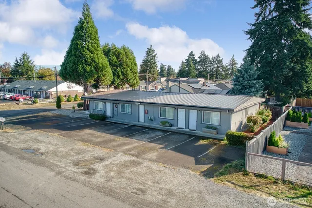 an aerial view of a house with a yard