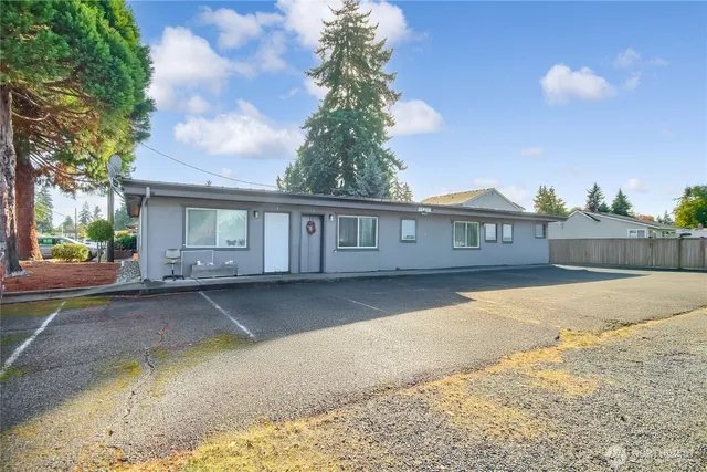 a front view of a house with yard