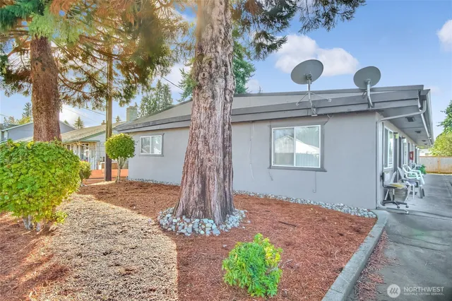 a front view of a house with garden
