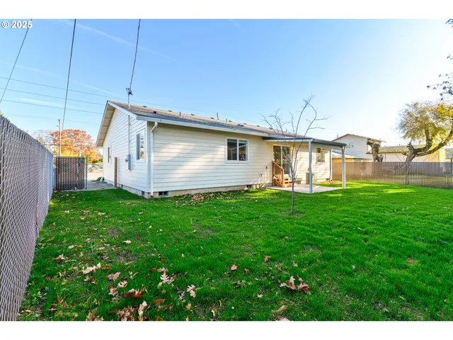 a front view of house with yard and seating area