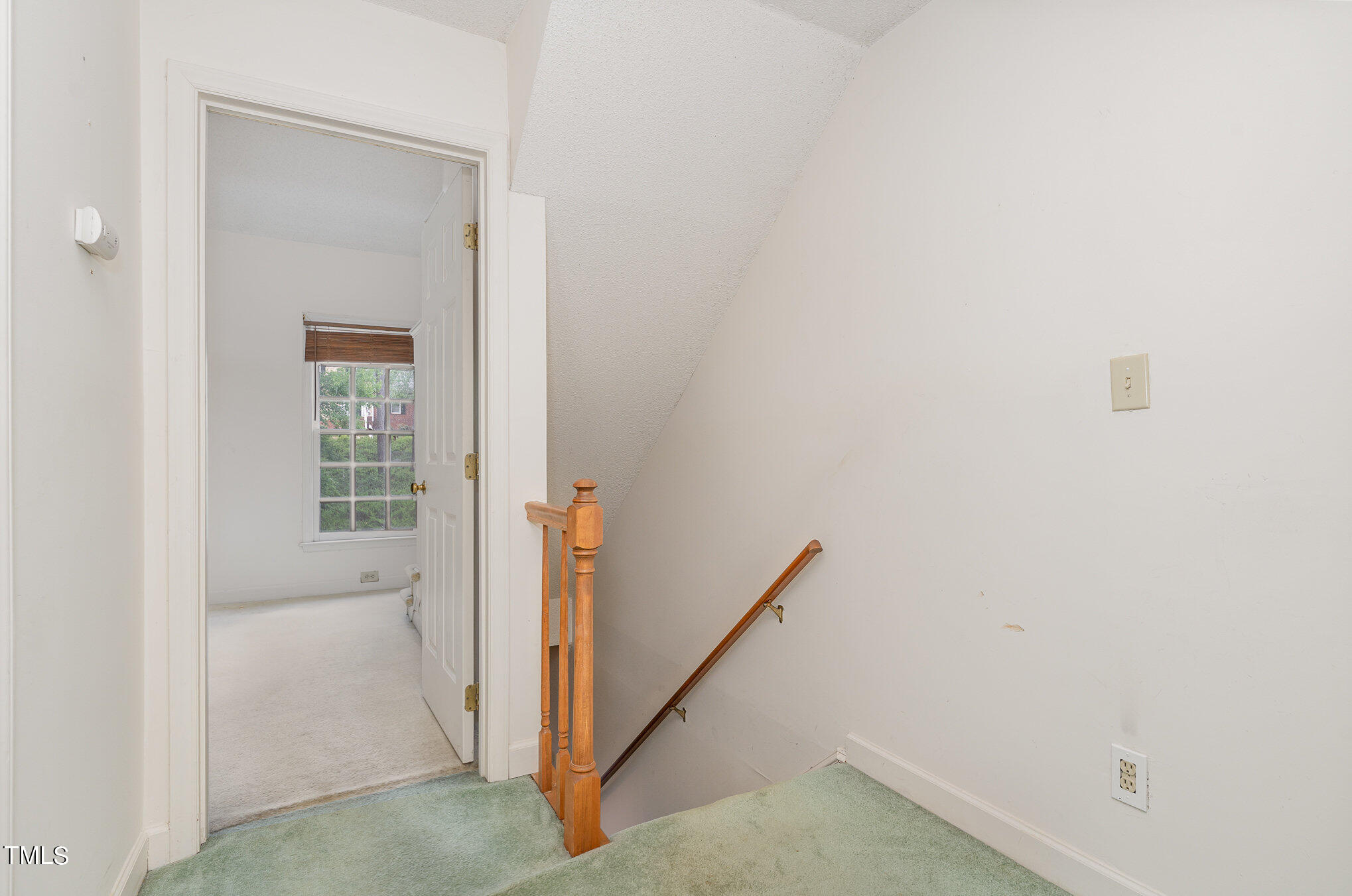 6700 Queen Annes Drive Raleigh, NC 27613 - Photo 19 of 28 a view of a hallway with a white door