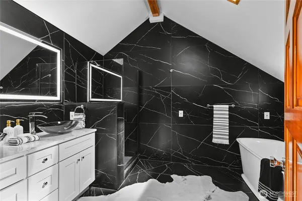 a bathroom with a shower and a sink