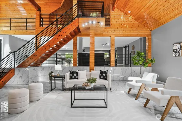 a view of the patio with couches and potted plants