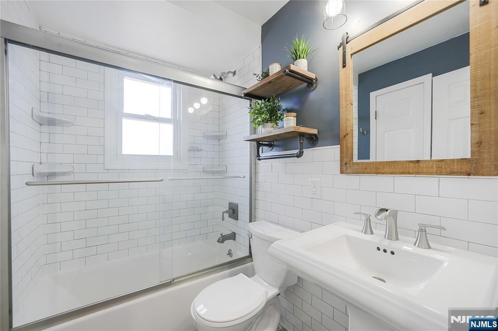 23-26 Berkshire Road Fair Lawn, NJ 07410 - Photo 13 of 36 a bathroom with a sink toilet and shower