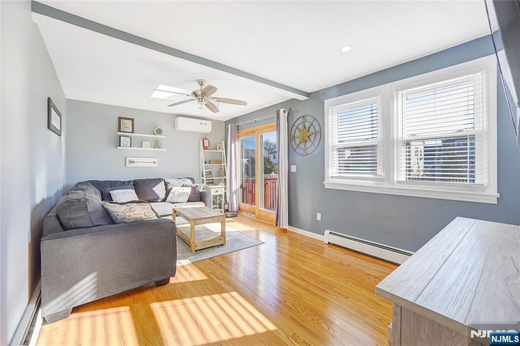 23-26 Berkshire Road Fair Lawn, NJ 07410 - Photo 18 of 36 a living room with furniture and a window