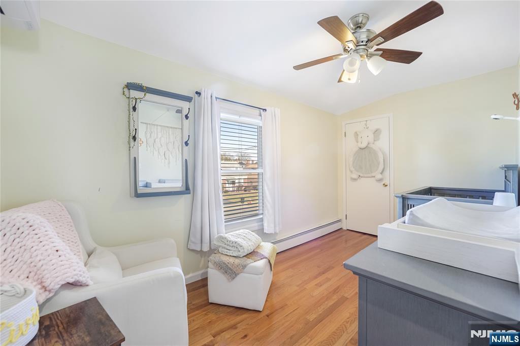 23-26 Berkshire Road Fair Lawn, NJ 07410 - Photo 21 of 36 a living room with furniture and a window