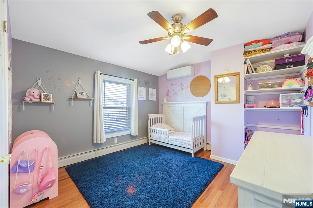 23-26 Berkshire Road Fair Lawn, NJ 07410 - Photo 22 of 36 a living room with furniture and wooden floor
