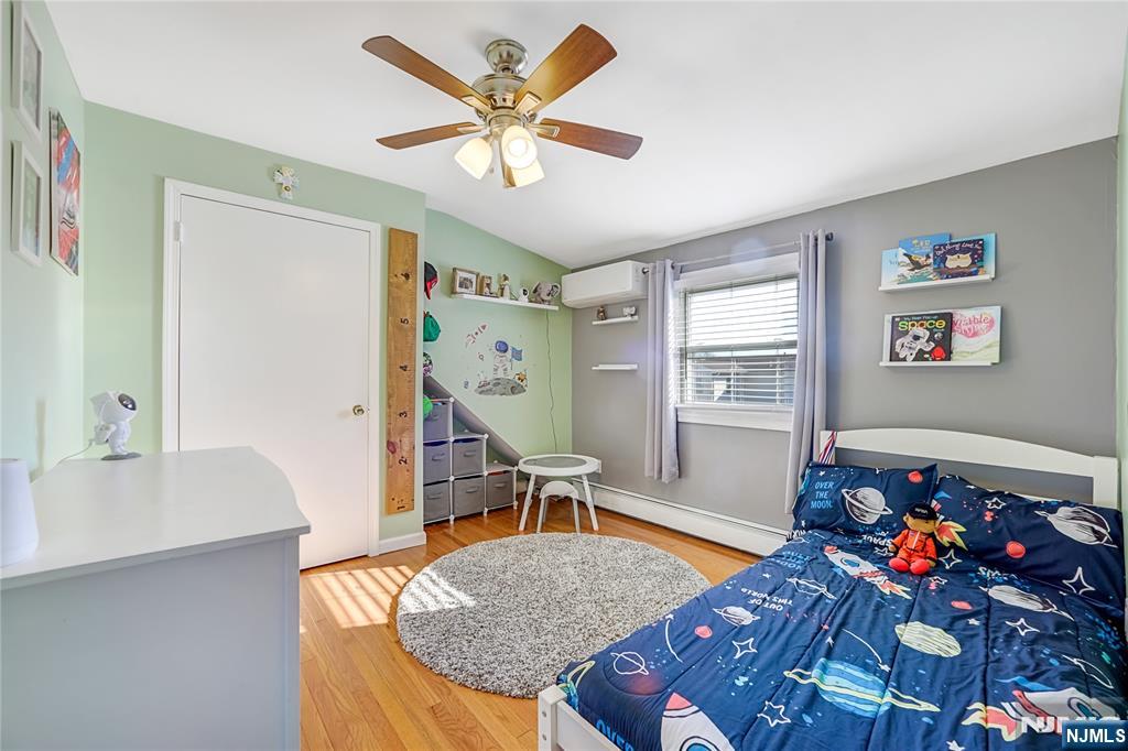 23-26 Berkshire Road Fair Lawn, NJ 07410 - Photo 23 of 36 a living room with furniture and wooden floor